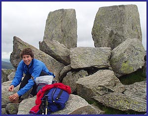 Sue repairs her feet at the summit of Tryfan