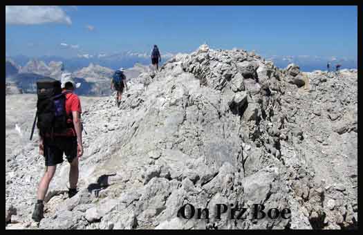 Striding out on Piz Boe, with the central Alps to the north