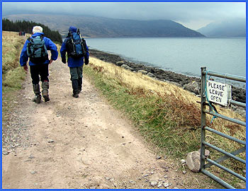 Andrew and Barry in obedient mode after passing an unusual gate sign - the rain is now imminent, but luckily 5 hours late!