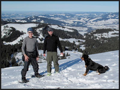 Markus and Martin in the Alps, with Muck the dog, and the cabin far below