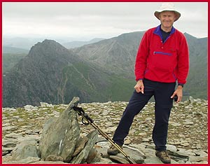 After the last big climb, Martin is happy to be on the summit of Pen yr Ole Wen, with Tryfan behind