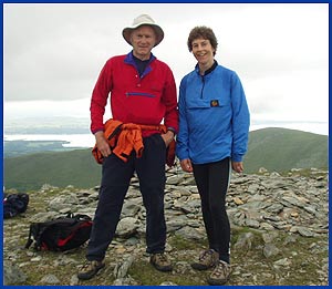 Sue and Martin on Yr Elen with the Welsh coast behind